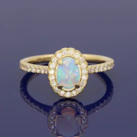 18ct Yellow Gold Oval Opal and Diamond Halo Ring