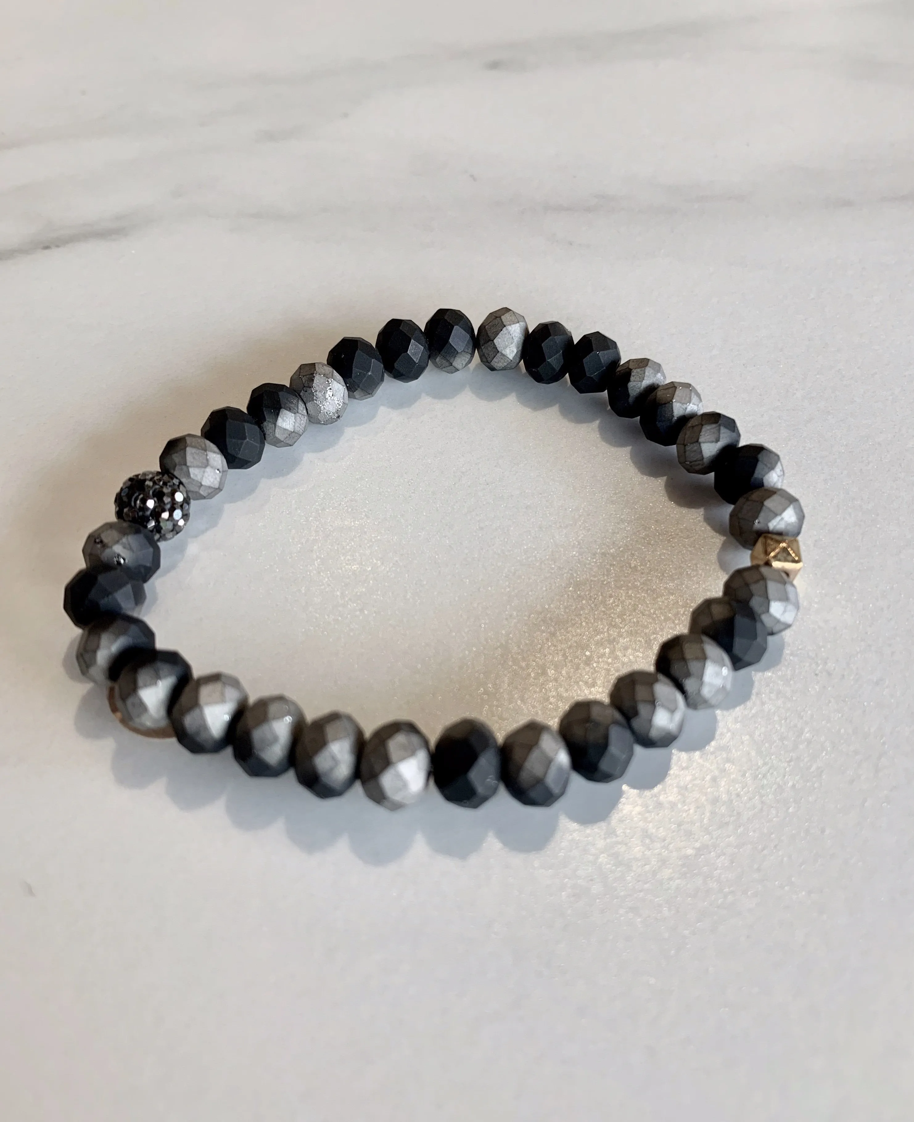 Matte Black and Silver Bracelet with 1 Gold Accent Bead and 1 Crystal Pave Bead